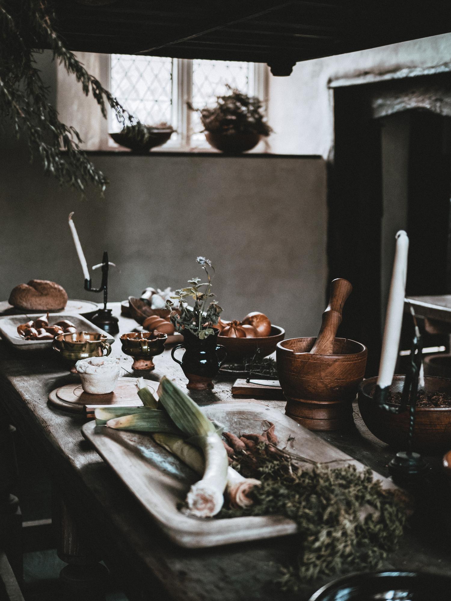 Interior of small culinary studio with utensils and herbs