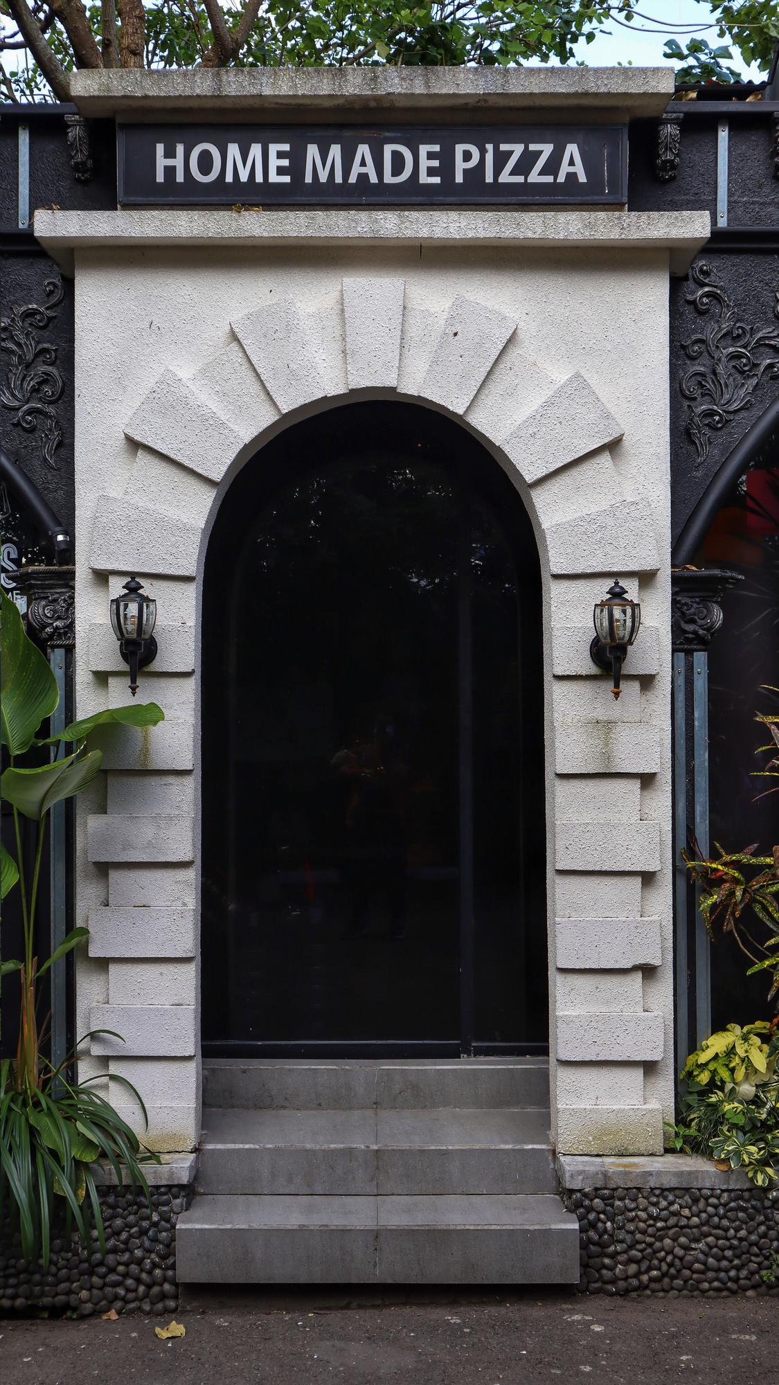 Exterior of culinary studio with small sign